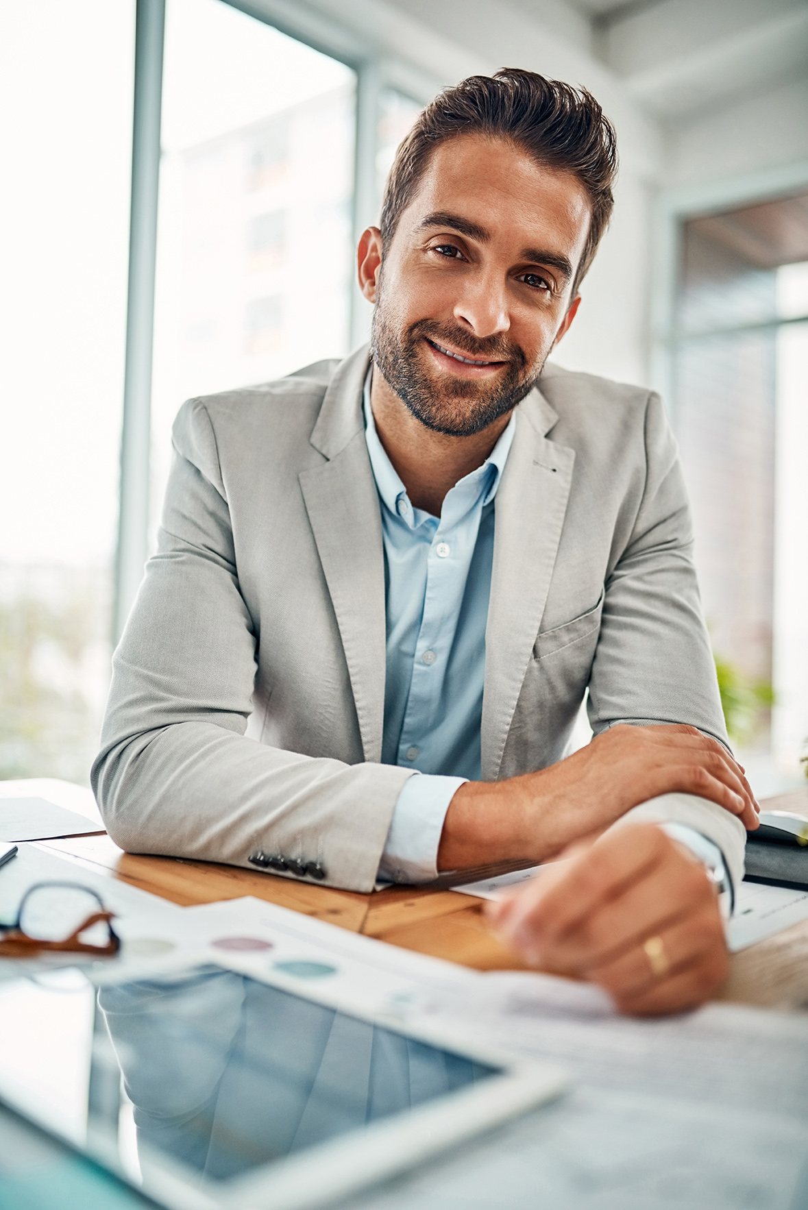 Work hard to fulfill your ambitious dreams. Portrait of a handsome young businessman sitting in an office. happy patient photo