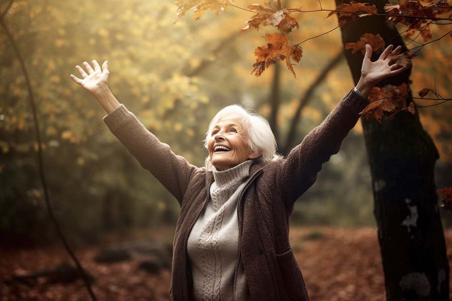 photo of senior woman raising her arms