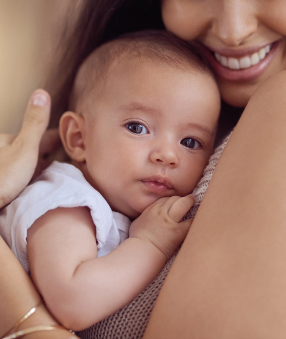 comfort-baby Mom comforting an infant photo