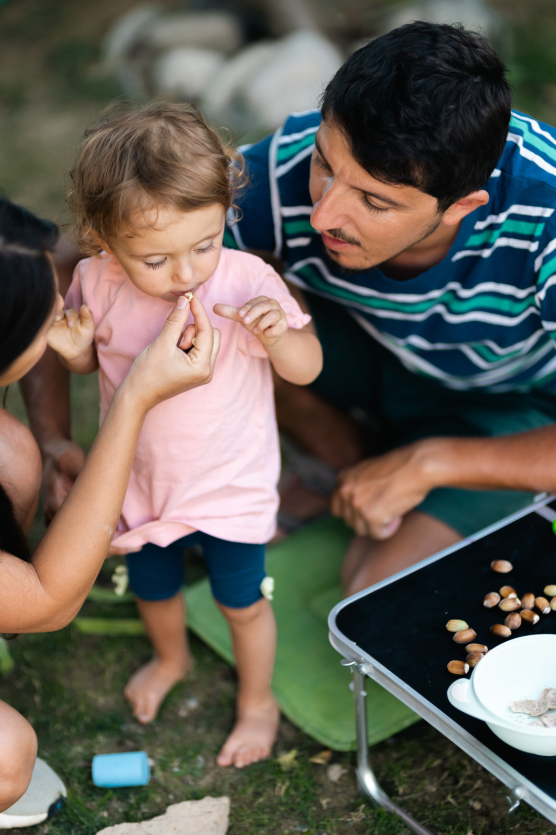 Family outdoors enjoying time together sharing food and bonding parent self care photo