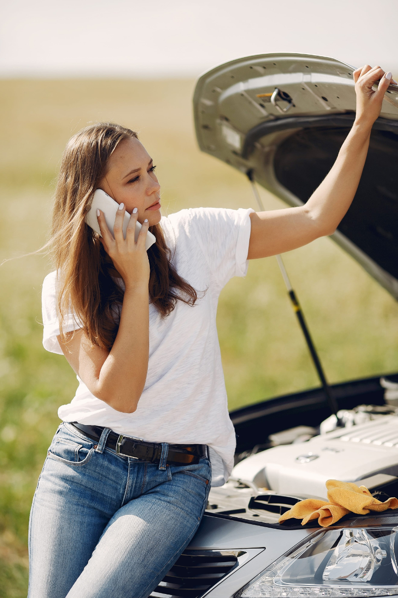 Woman near broken car call for help photo of maintaining your car like you maintain your body