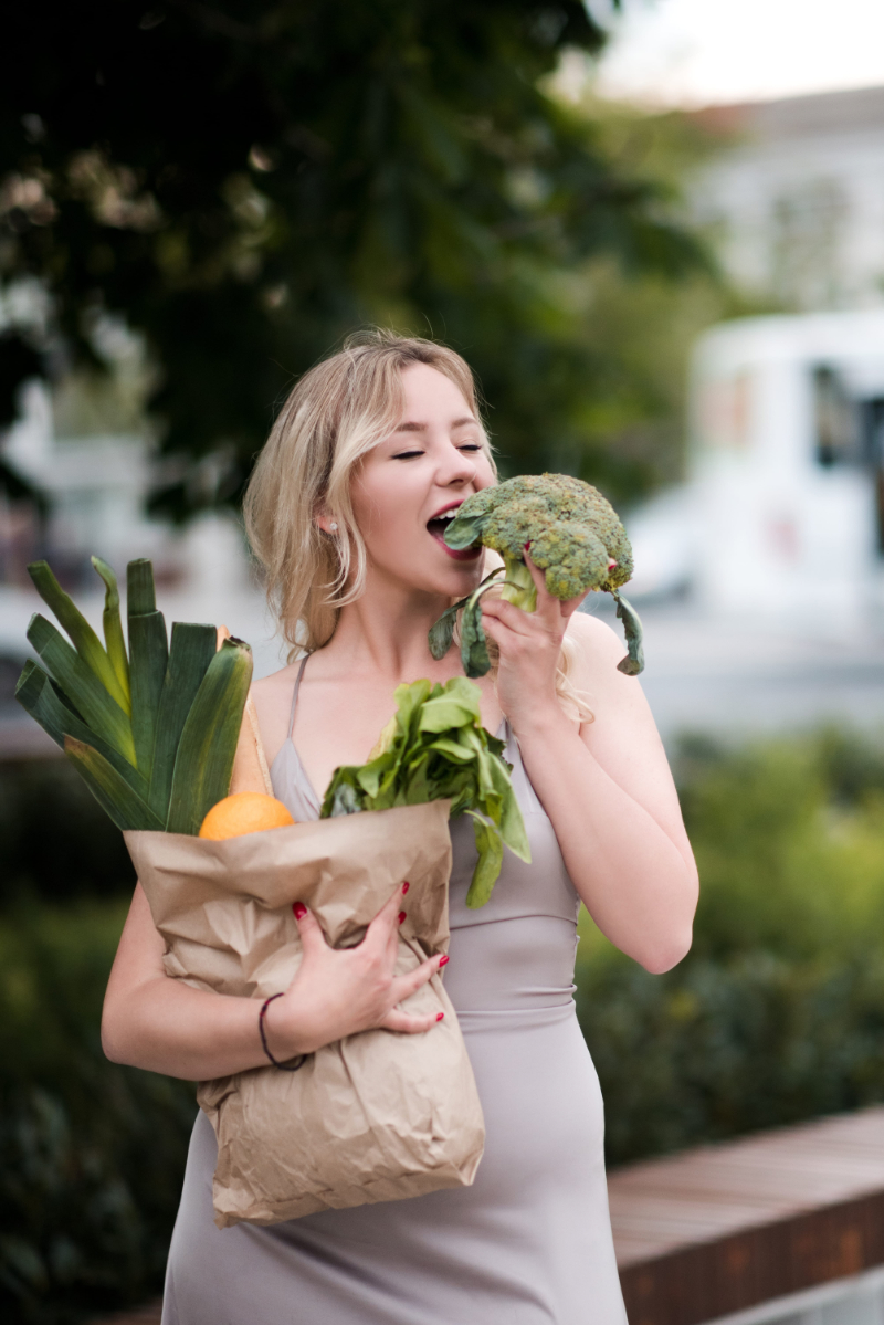 carrying-groceries Adult carrying groceries and bags while balancing everyday family responsibilities